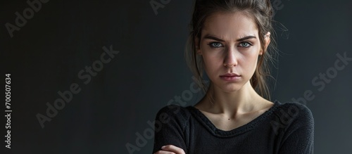 Displeased pissed off angry grumpy pessimistic woman with bad attitude arms crossed looking at you Negative human emotion facial expression feeling. Creative Banner. Copyspace image photo