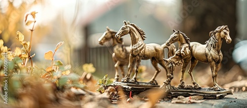 Beautiful crafted miniature horses made of brass arranged for sale. Creative Banner. Copyspace image