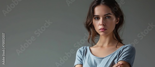 Displeased pissed off angry grumpy pessimistic woman with bad attitude arms crossed looking at you Negative human emotion facial expression feeling. Creative Banner. Copyspace image photo