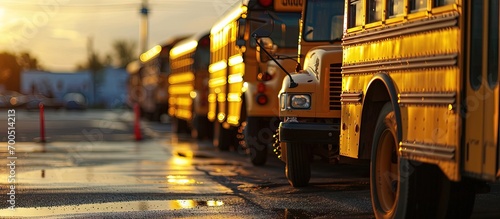 Buses at the school waiting for the kids to get on. Creative Banner. Copyspace image photo