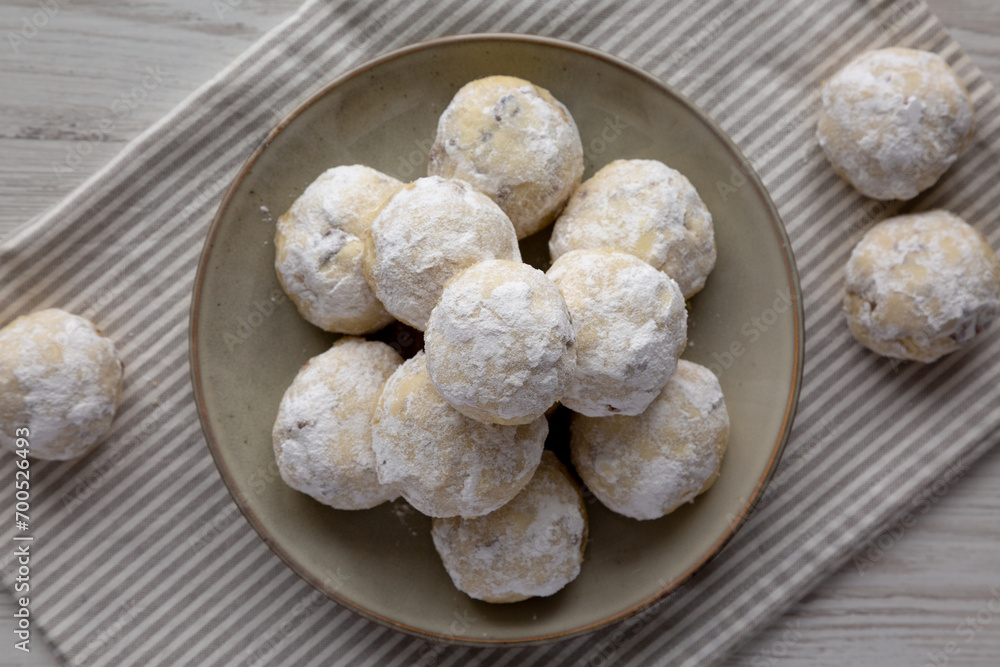 Homemade Snowball Cookies on a Plate, top view. Flat lay, overhead, from above. Homemade Snowball Cookies on a Plate, top view. Flat lay, overhead, from above.