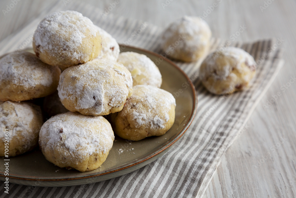 Homemade Snowball Cookies on a Plate, side view. Homemade Snowball Cookies on a Plate, side view.