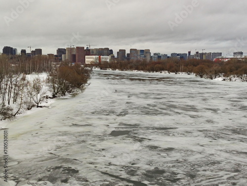 Winter river on the outskirts of the metropolis