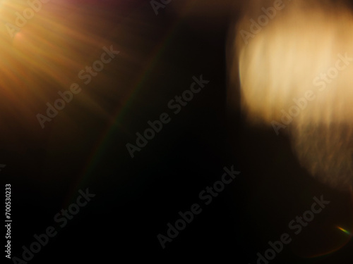Abstract lens flare on dark background for special lighting effect and graphic design. photo