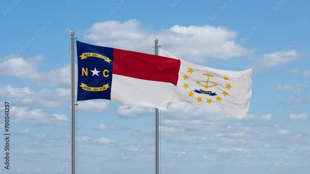 Rhode Island and North Carolina US state flags waving together on cloudy sky, endless seamless loop Rhode Island and North Carolina US state flags waving together on cloudy sky, endless seamless loop