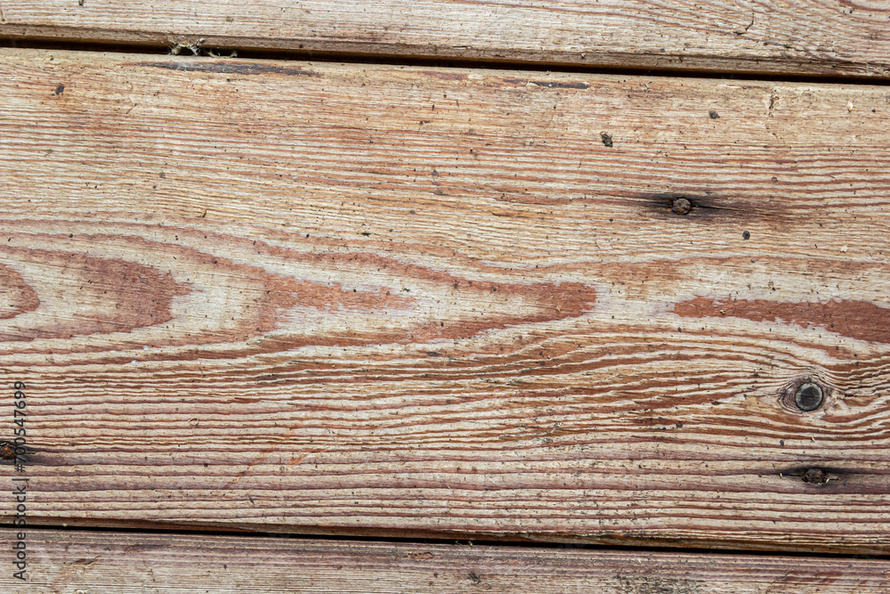Naklejka premium wooden table texture. brown planks as background