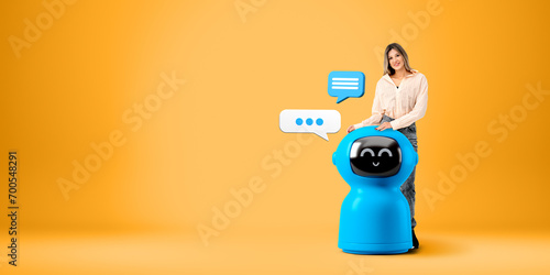 Young woman and her chat bot robot assistant with speech bubbles photo