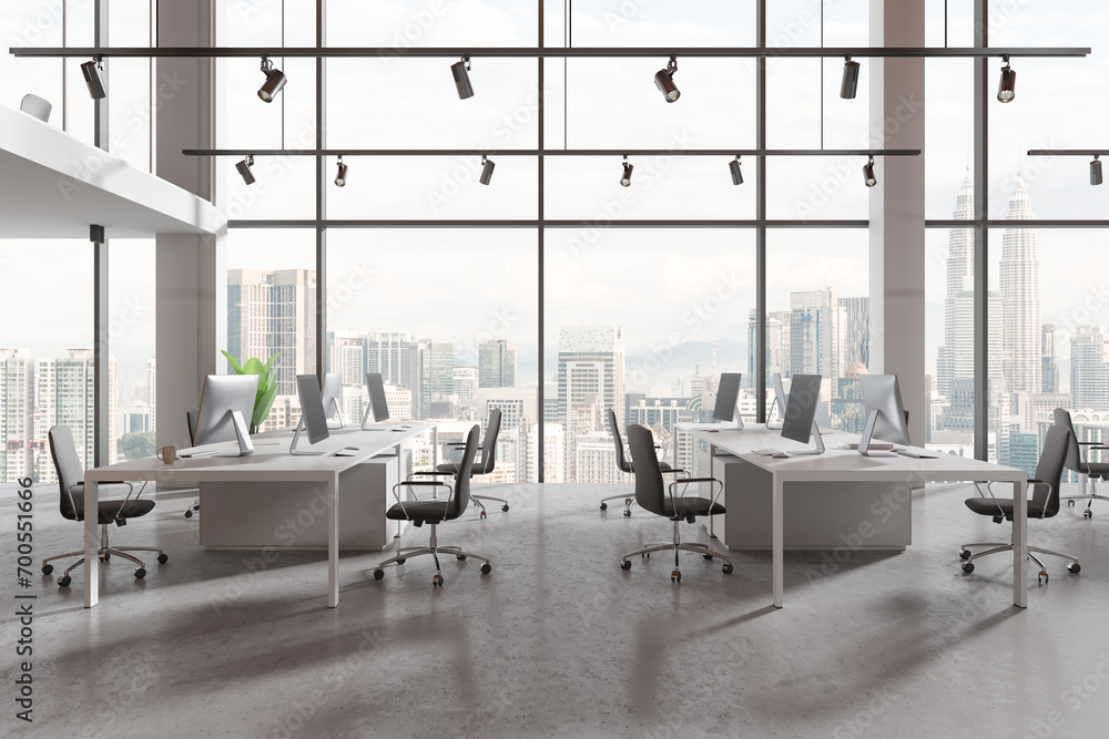 Fototapeta premium Office coworking interior with pc monitors in row, panoramic window