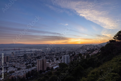 Beautiful panoramic view from Mount Carmel (Louis Promenade) beautiful dramatic marmalade sky cityscape and port in Haifa, Israel.