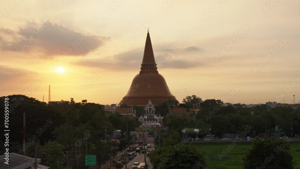 Golden pagoda of Phra Pathom Chedi with sunset sky in downtown Golden pagoda of Phra Pathom Chedi with sunset sky in downtown