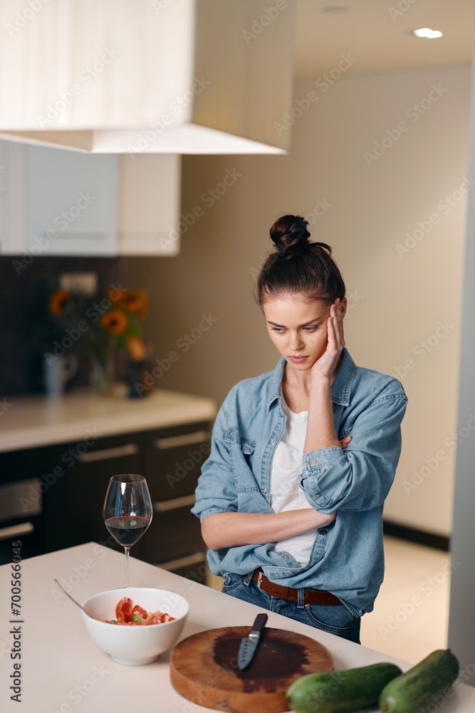 Lonely Woman Sitting at a Kitchen Table, Upset and Thoughtful, Expressing Sadness and Despair Amidst Domestic Troubles and Health Problems: A Portrait of Unhappiness Lonely Woman Sitting at a Kitchen Table, Upset and Thoughtful, Expressing Sadness and Despair Amidst Domestic Troubles and Health Problems: A Portrait of Unhappiness
