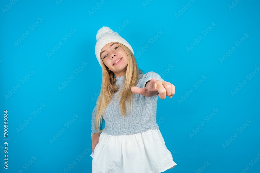 beautiful caucasian teen girl wearing grey sweater pointing at camera with a satisfied, confident, friendly smile, choosing you beautiful caucasian teen girl wearing grey sweater pointing at camera with a satisfied, confident, friendly smile, choosing you