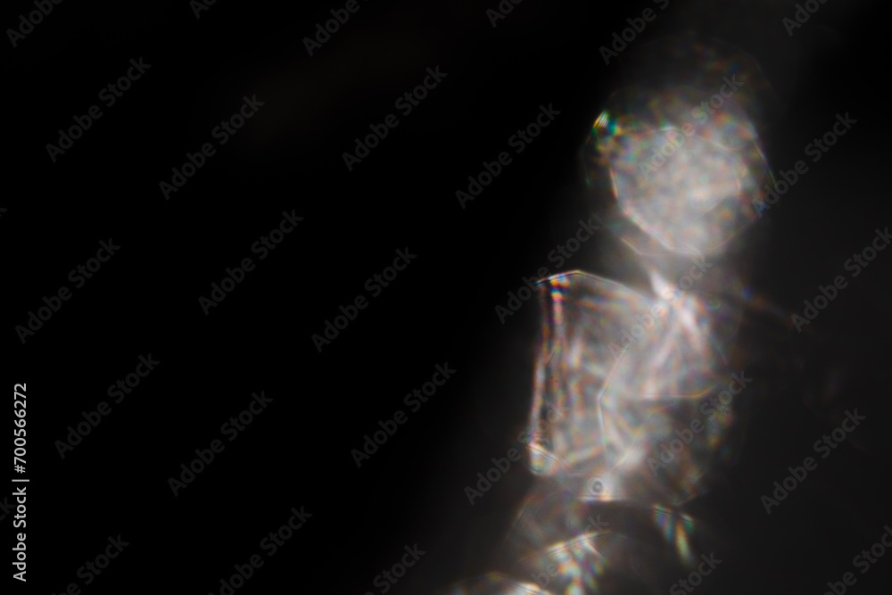 Blur colorful rainbow crystal light leaks on black background. Defocused abstract multicolored retro film lens flare bokeh analog photo overlay or screen filter effect. Glow Vintage prism colors