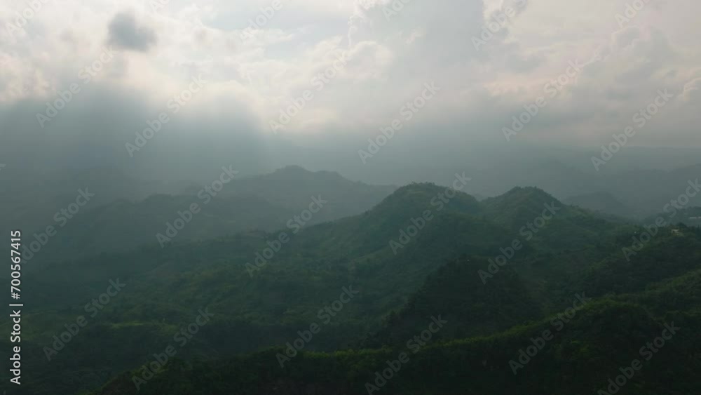Mountain slopes with rainforest, cloudy sunset on countryside. Mindanao, Philippines. Mountain slopes with rainforest, cloudy sunset on countryside. Mindanao, Philippines.