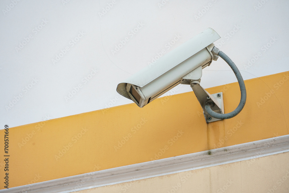 Video surveillance systems. Security systems and protection from theft. Security CCTV camera installed on the facade of a residential building. Digital technology.