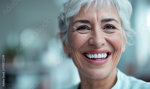 Dentist, veneers or dentures in senior woman mouth or teeth looking happy with her oral hygiene or dental cleaning cosmetic service.