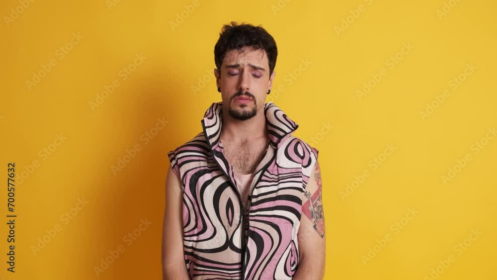 Sad and worried gay man looking at the camera Sad and worried gay man looking at the camera