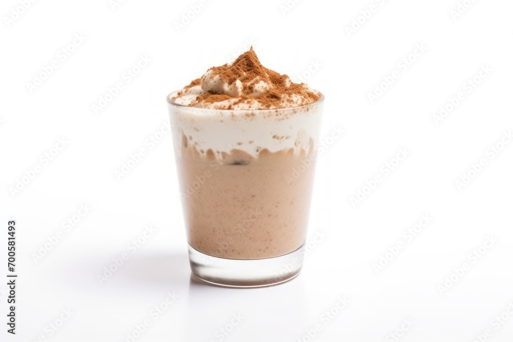 Isolated frappe cup with cream and cinnamon powder on white background Isolated frappe cup with cream and cinnamon powder on white background