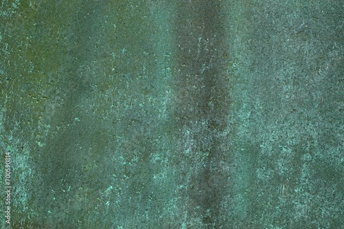 Closeup of aged weathered copper plate texture with green patina. photo