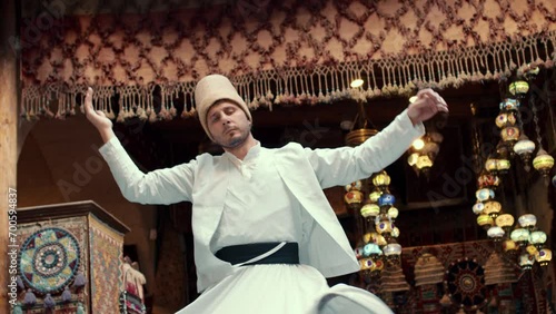 Sufi Whirling Dervish dance in traditional dress. Turkey photo