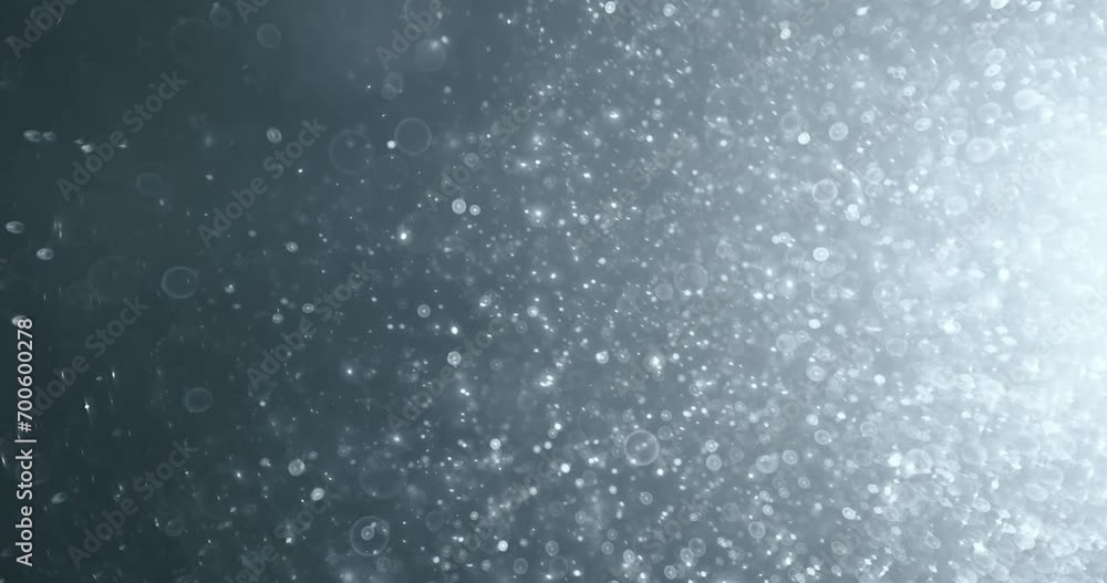 Floating abstract particle bokeh on dark background Floating abstract particle bokeh on dark background