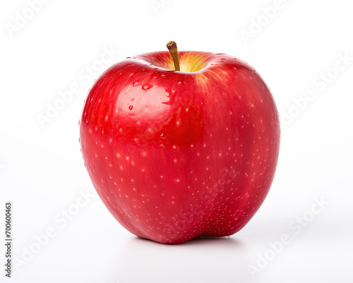 A vibrant, juicy red apple covered in water droplets, showcasing its freshness and flavor. The apple is isolated on a white background, highlighting its natural color and texture.