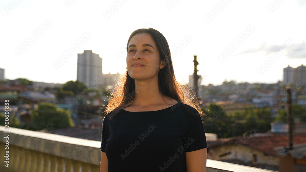 Portrait of a Gorgeous Woman Smiling Charmingly on a beautiful sunny day. Happy Young Woman Enjoys Life

