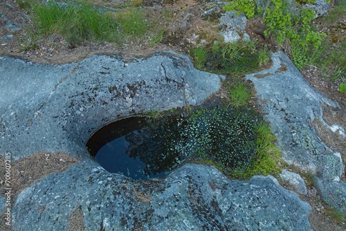 Billede på lærred A giant´s kettle, glacial pothole, giant´s cauldron or moulin pothole drilled in solid rock
 underlying a glacier, Hanko, Finland