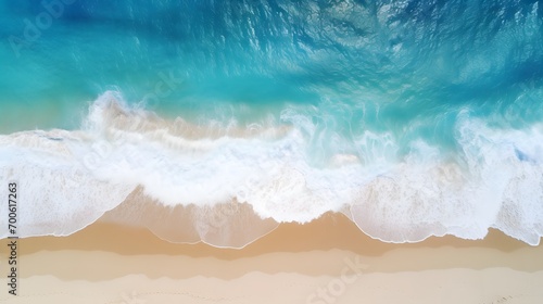 Top down view of waves landing on a sandy beach, background