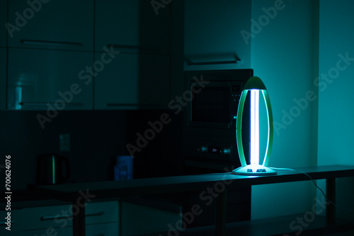 germicidal uvc sterilization lamp for home use. Surface and air disinfection. Ultraviolet light cleaning photo