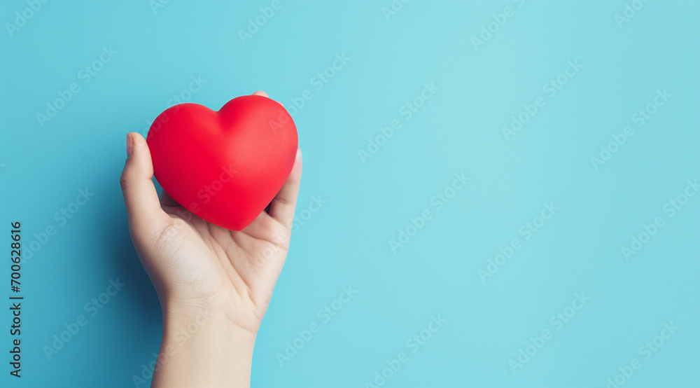 The essence of love with hands presenting a red heart on a serene blue background, an eloquent symbol of affection. Generative AI. The essence of love with hands presenting a red heart on a serene blue background, an eloquent symbol of affection. Generative AI.