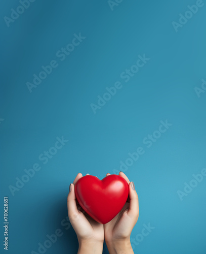 The essence of love with hands presenting a red heart on a serene blue background  an eloquent symbol of affection. Generative AI.
