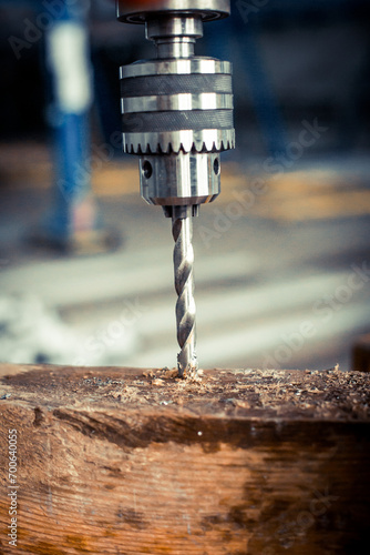 Drilling machine in the workshop, working with a drill
