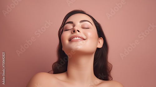 Radiant Beauty  The Joy of a Young  Overweight Woman with Smooth  Healthy Face Skin  Smiling Happily and Touching Her Face in a Studio Setting on an Isolated Solid Color Background