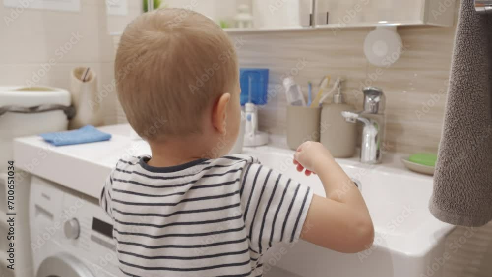 three year old child little boy learns to brush teeth in the bathroom three year old child little boy learns to brush teeth in the bathroom