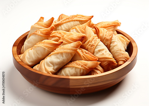 View of Delicious Winter Food Patishapta Pitha in a bowl photo