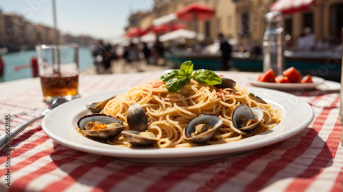 a plate of spaghetti with clams on the table with the background of the canals of Venice and the blurred gondolas