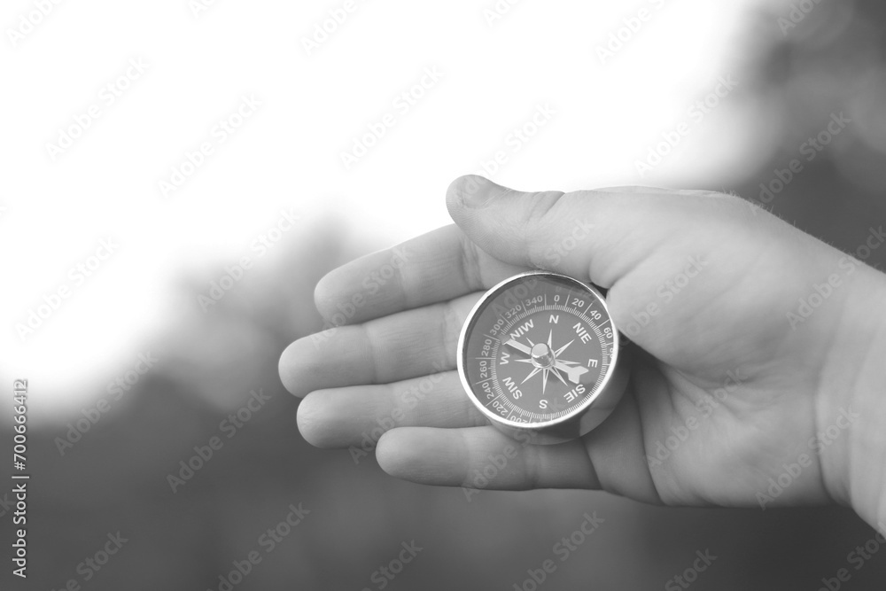 black and white photo of round compass black and white photo of round compass
