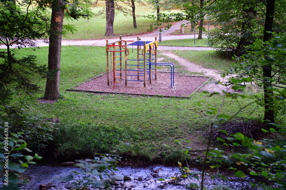 Climbing ladders for children in the forest park with a sandpit