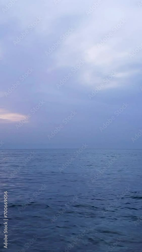 Blue Sea waves floating and hitting with stones on beach Blue Sea waves floating and hitting with stones on beach