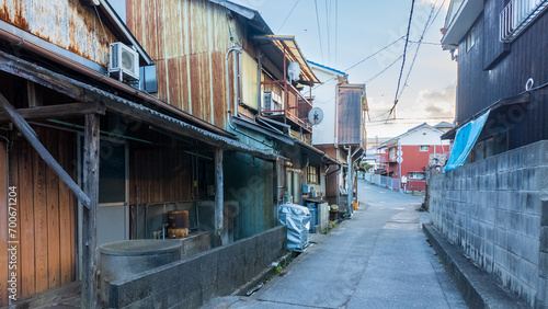 Narrow road between old houses in small town Japan photo