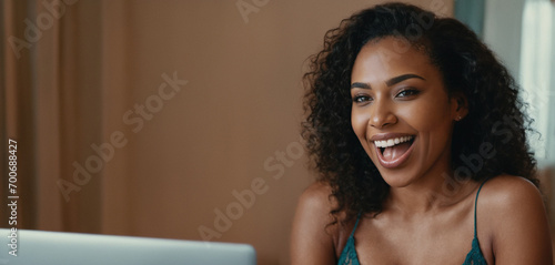 adult woman sits on the bed at the computer on the laptop notebook, online streaming or video call