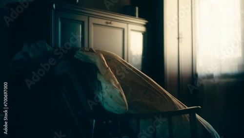 Old woman possessed by demonic spirit sitting in armchair, having convulsions
