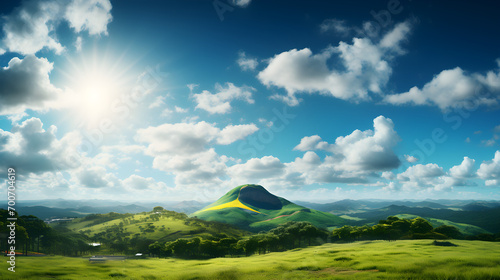Beautiful valley in Castelluccio at summer, Umbria, Italy, Green sunny mountain landscape with big white cloud in form of explosion in blue sky above green hills in sunlight. Beautiful sunny scenery w photo