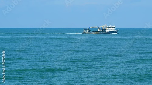 Fishing Boat In The Black Sea. Clear Good Weather In Morninng. Real time. photo