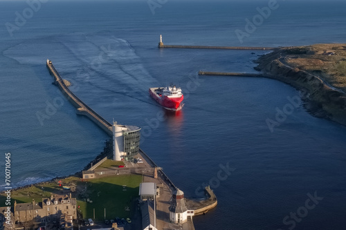 Ship arriving at Aberdeen harbour after passing Girdle Ness Lighthouse photo