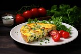  piece of frittata with vegetables and herbs on a white plate.omelet.breakfast