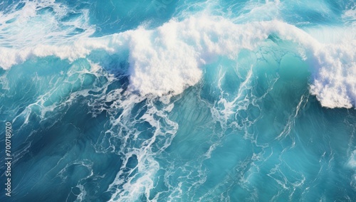 An aerial view of a wave breaking in the ocean