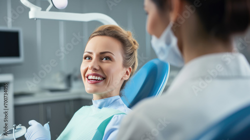 Young woman with a bright smile is in a dental chair during an examination