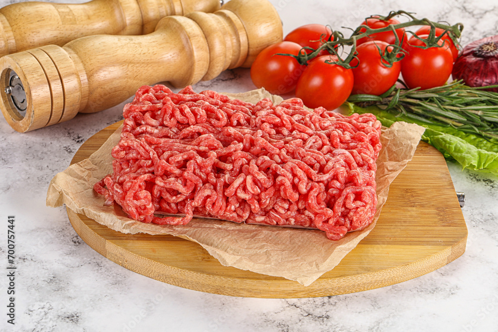Raw minced beef meat on cutting board Raw minced beef meat on cutting board